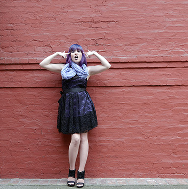 Red wall and attitude: model Kristy LaCasse